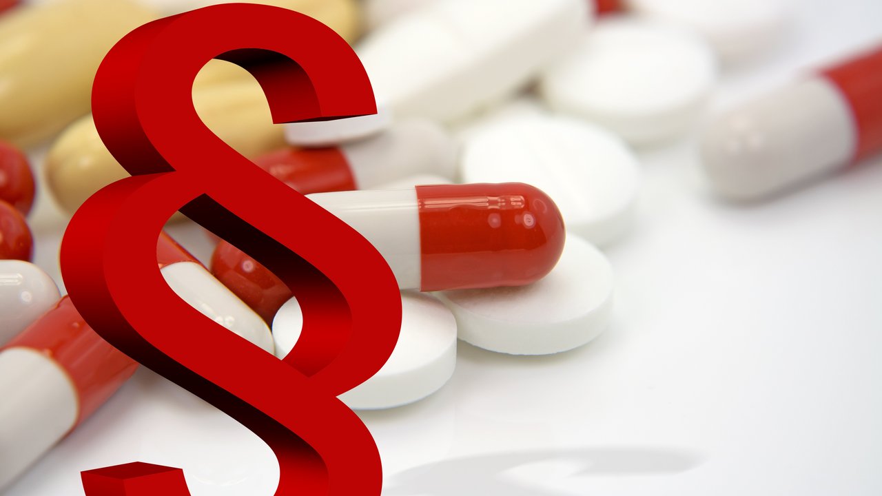 Paragraphenzeichen und Pillen