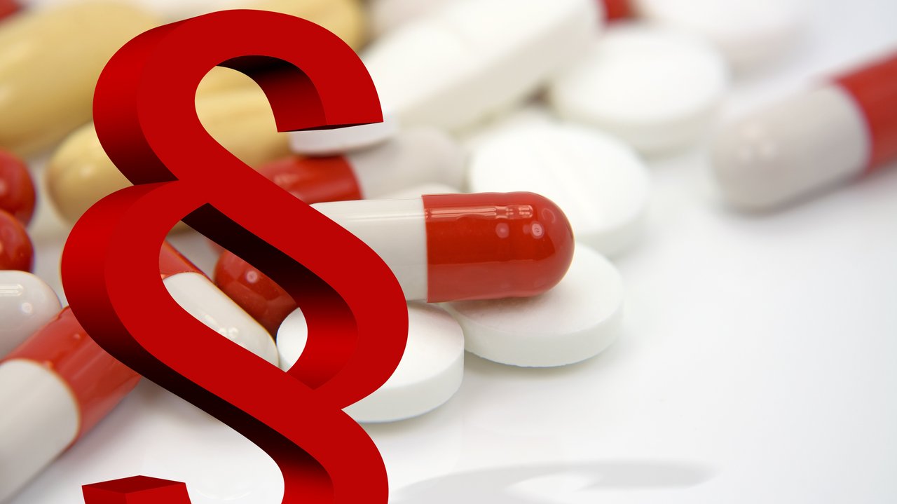 Paragraphenzeichen und Pillen