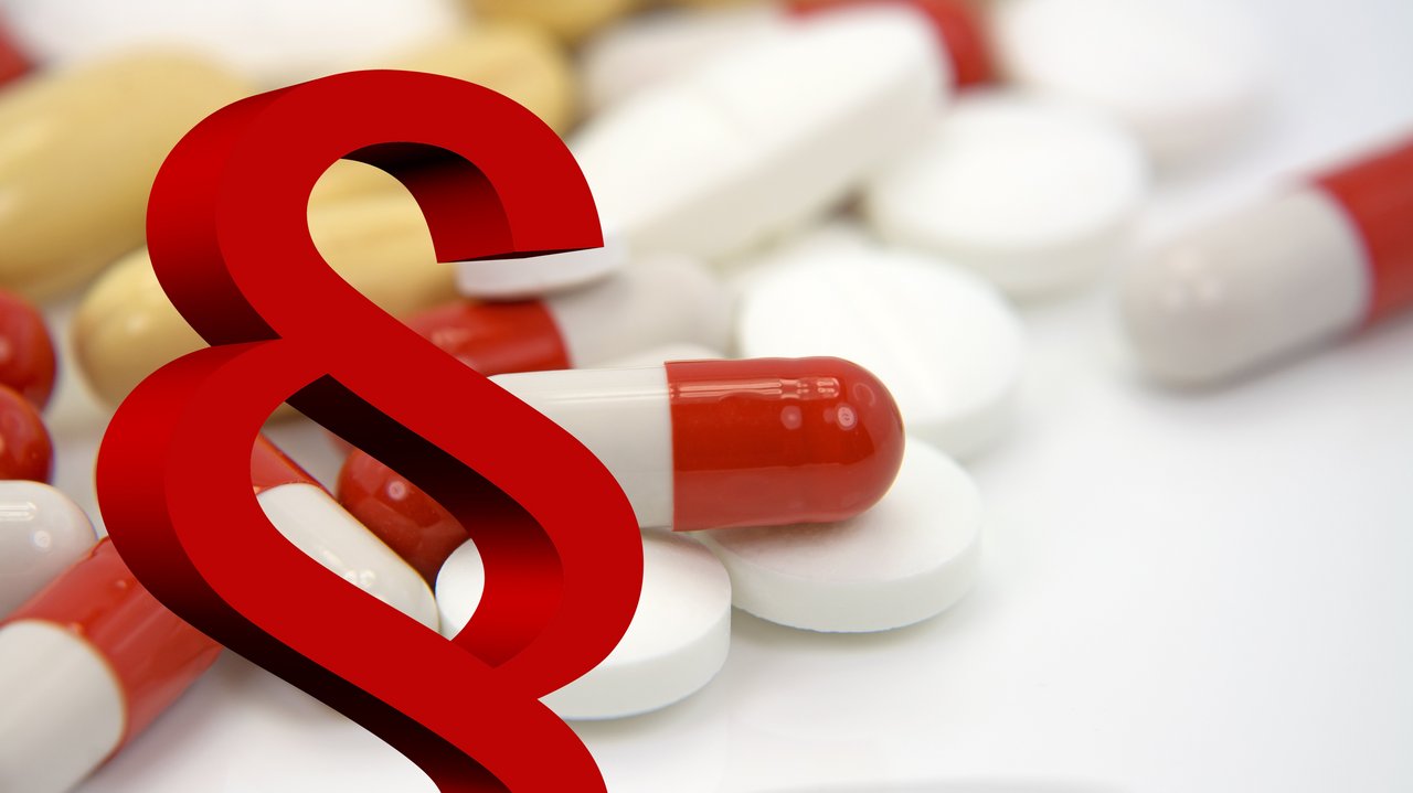 Paragraphenzeichen und Pillen