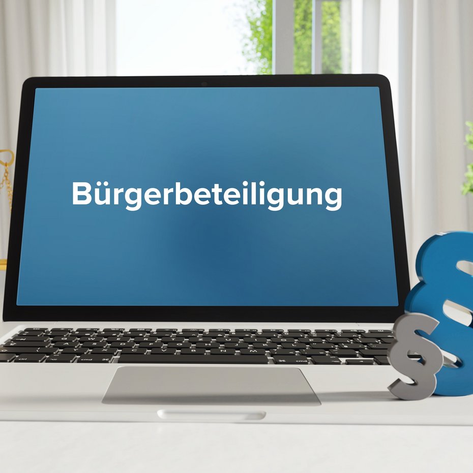 Laptop mit dem Begriff "Bürgerbeteiligung" auf dem Bildschirm